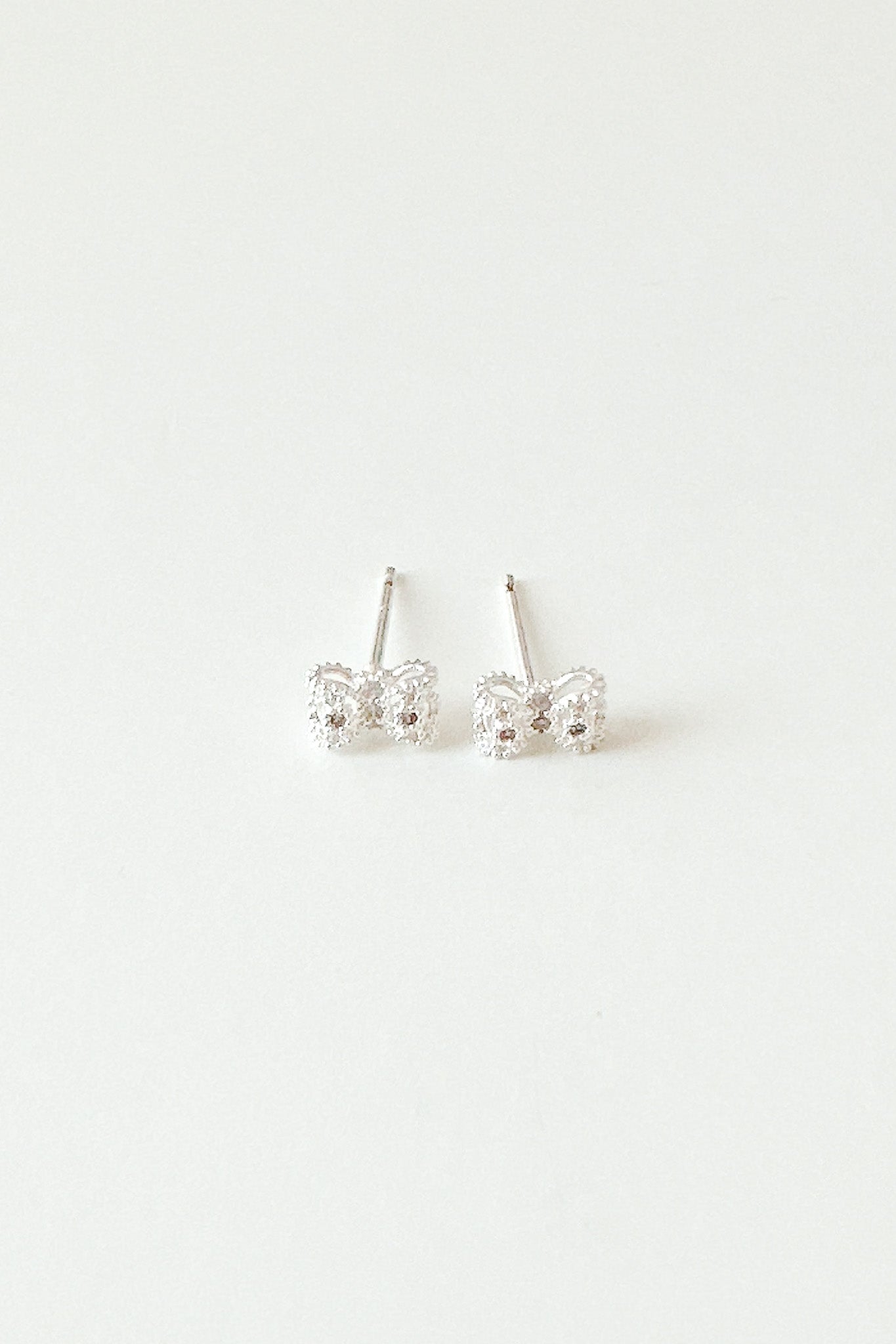 
                  
                    23240 Mini Silver Ribbon Earrings
                  
                